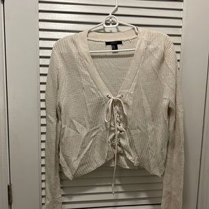Cropped tie front sweater